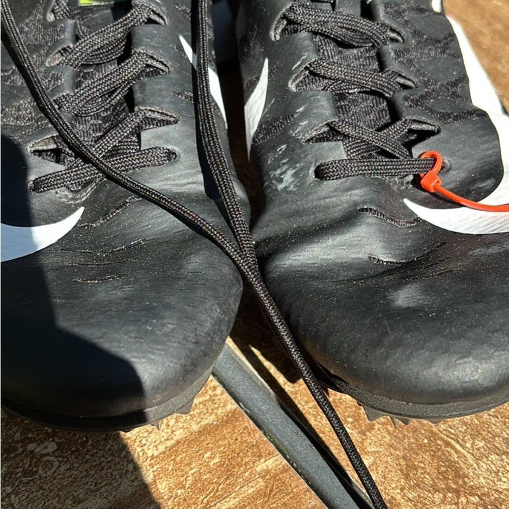 Nike women’s Black and White Athletic Cleats